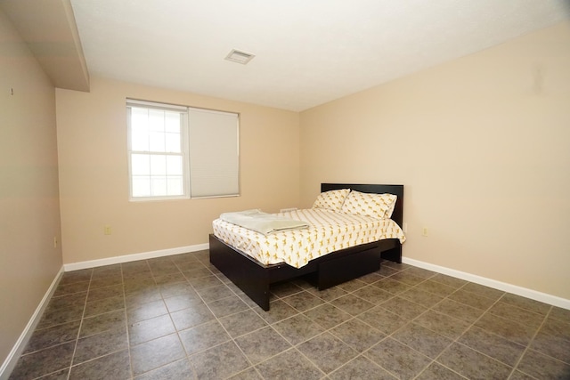 96 River Rd Unit 205, Manchester, NH 03104 - bedroom with baseboards and dark tile patterned floors