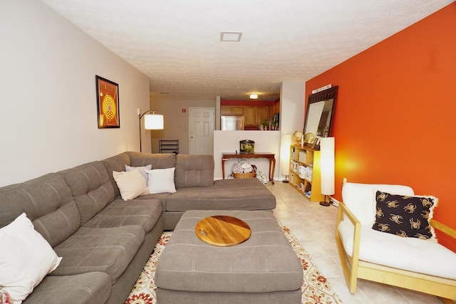 96 River Rd Unit 205, Manchester, NH 03104 - living room featuring a textured ceiling and light tile patterned floors