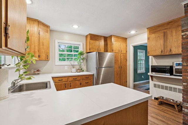8 Willow Spring Ln, Hanover, NH 03755 - kitchen featuring stainless steel appliances, radiator heating unit, light countertops, wood finished floors, and recessed lighting