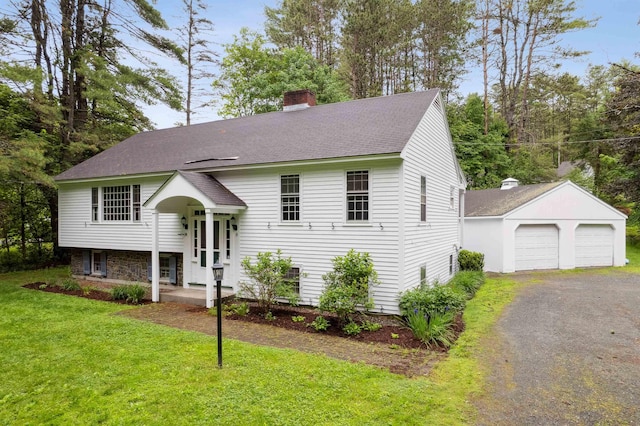 8 Willow Spring Ln, Hanover, NH 03755 - split foyer home with a chimney, an outdoor structure, a detached garage, a shingled roof, and a front yard