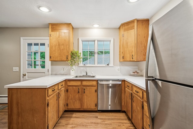 8 Willow Spring Ln, Hanover, NH 03755 - kitchen with appliances with stainless steel finishes, a peninsula, light wood-style floors, light countertops, and recessed lighting