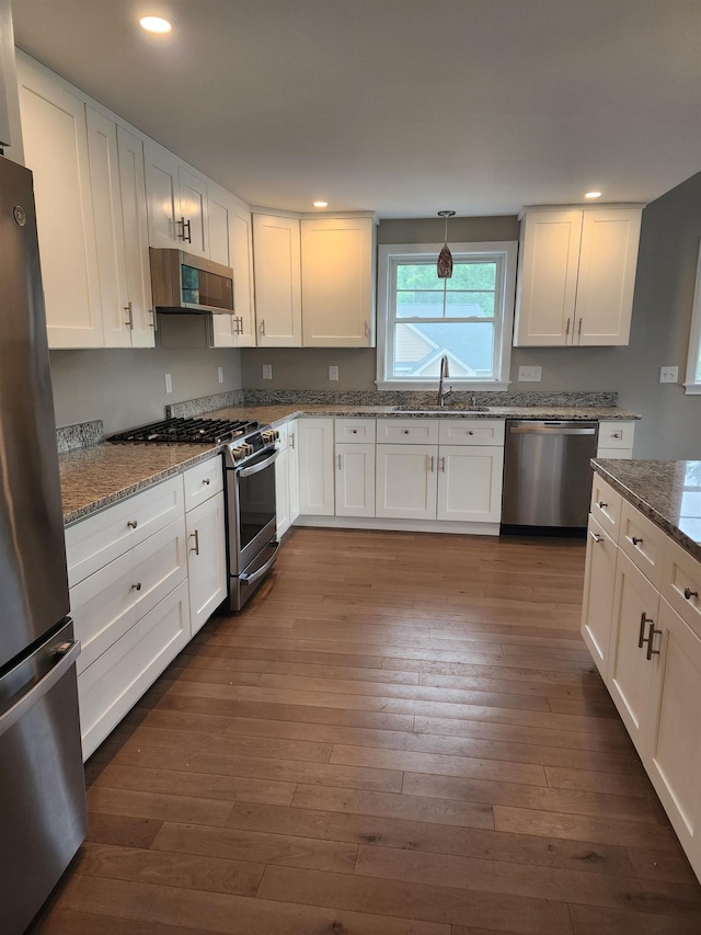 22 John Hardie Way, Chichester, NH 03234 - kitchen with stainless steel appliances, white cabinetry, light stone countertops, recessed lighting, and dark wood-style floors