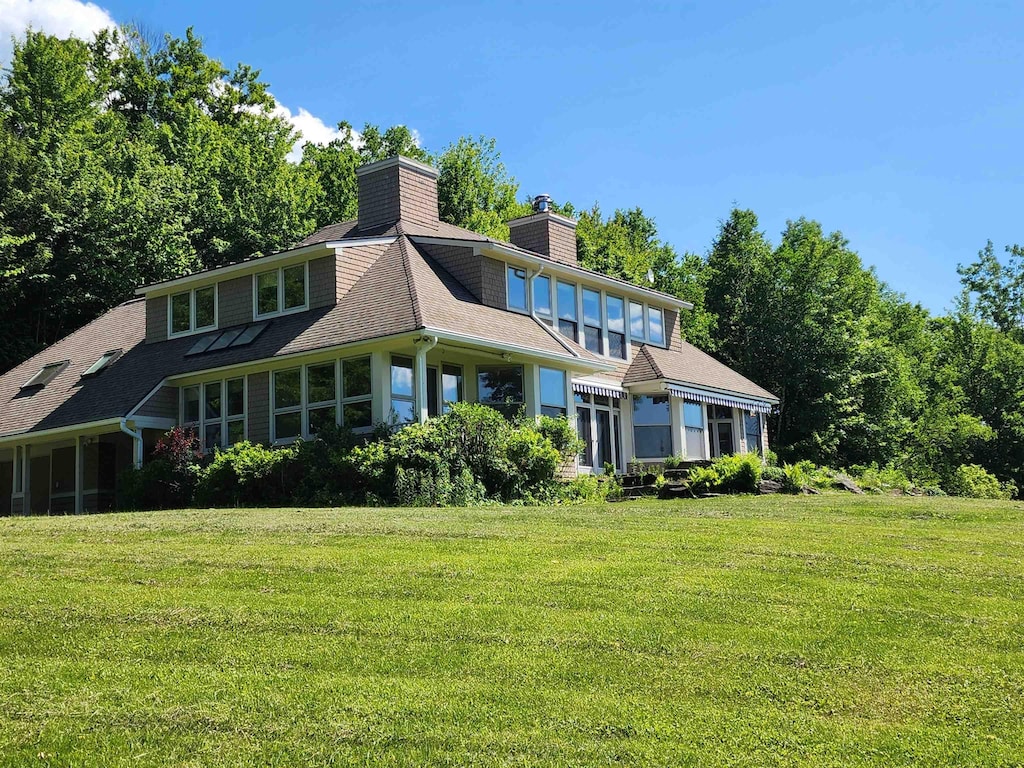 201 Lower Judson Ln, Stowe, VT 05672 - rear view of property with a lawn, a chimney, and a shingled roof