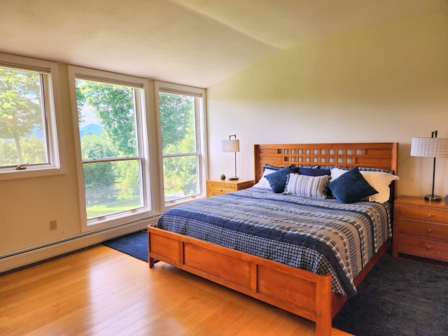 201 Lower Judson Ln, Stowe, VT 05672 - bedroom featuring lofted ceiling, wood finished floors, and baseboard heating