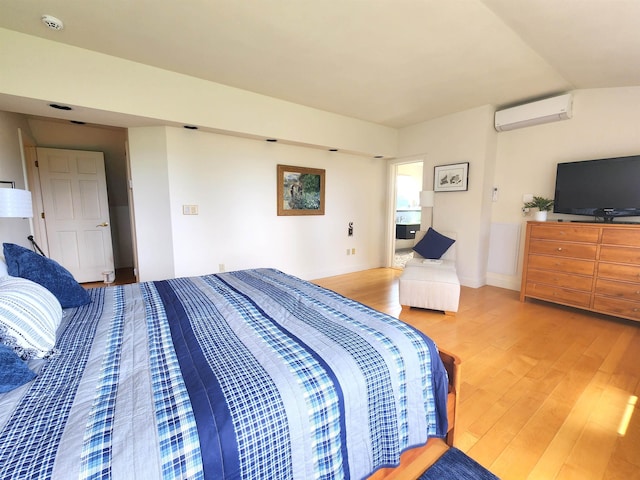 201 Lower Judson Ln, Stowe, VT 05672 - bedroom featuring an AC wall unit and wood finished floors