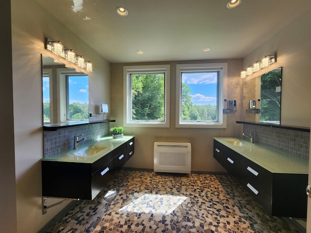 201 Lower Judson Ln, Stowe, VT 05672 - full bathroom with backsplash, two vanities, recessed lighting, and heating unit