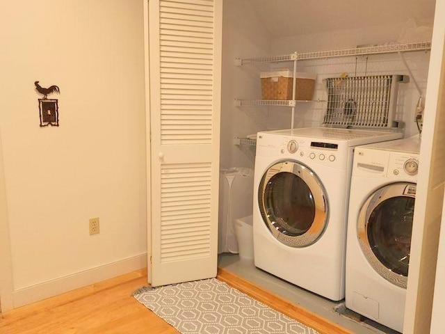 201 Lower Judson Ln, Stowe, VT 05672 - laundry area featuring independent washer and dryer and light wood-style flooring