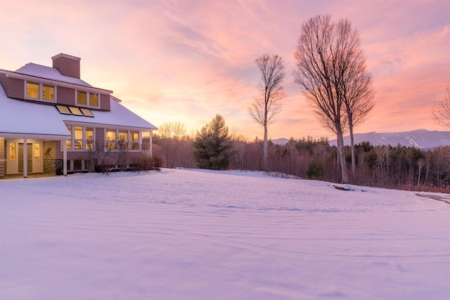 201 Lower Judson Ln, Stowe, VT 05672 - yard layered in snow with a sunroom