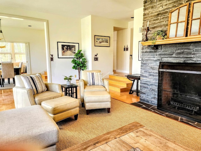 201 Lower Judson Ln, Stowe, VT 05672 - living room featuring a stone fireplace and wood finished floors