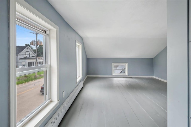 10 Lafountain St, Winooski, VT 05404 - additional living space featuring vaulted ceiling, wood finished floors, and a baseboard heating unit
