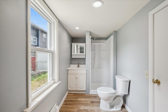 10 Lafountain St, Winooski, VT 05404 - bathroom featuring a shower, vanity, wood finished floors, and recessed lighting
