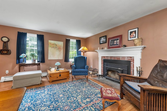 4 June Bug Ln, Wolfeboro, NH 03894 - living room featuring plenty of natural light, a brick fireplace, and baseboard heating