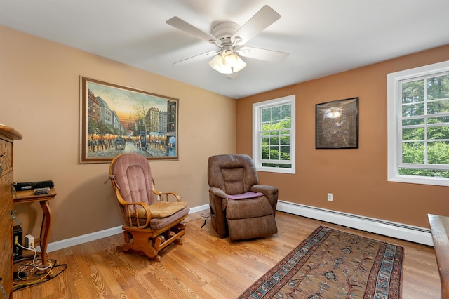 4 June Bug Ln, Wolfeboro, NH 03894 - living area featuring baseboard heating, light wood-style floors, and ceiling fan