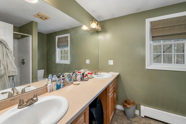4 June Bug Ln, Wolfeboro, NH 03894 - bathroom with baseboard heating, double vanity, a shower, and tile patterned flooring