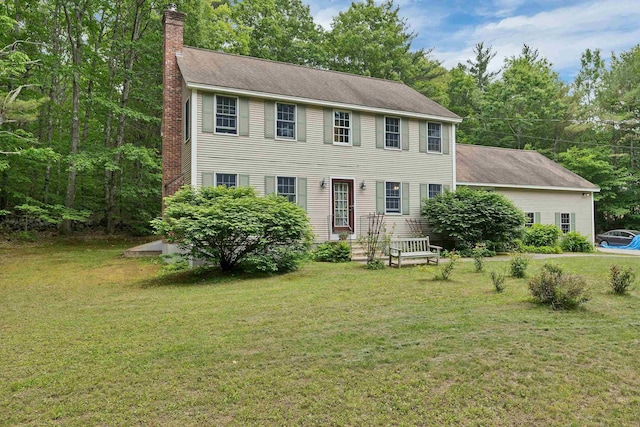 4 June Bug Ln, Wolfeboro, NH 03894 - colonial home featuring a chimney, a front lawn, and roof with shingles