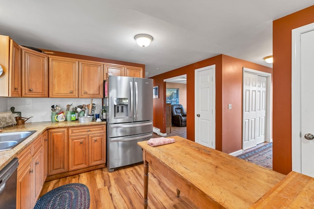 4 June Bug Ln, Wolfeboro, NH 03894 - kitchen featuring stainless steel appliances, light wood-style floors, wooden counters, and backsplash