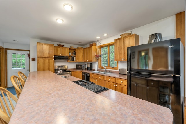 481 New Orchard Rd, Epsom, NH 03234 - kitchen with black appliances, ventilation hood, healthy amount of natural light, light countertops, and recessed lighting