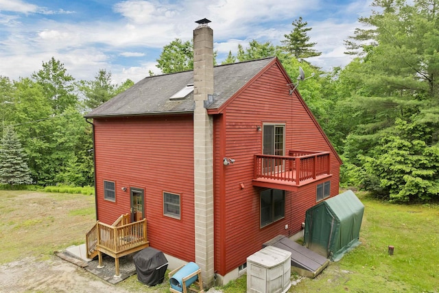 481 New Orchard Rd, Epsom, NH 03234 - back of property featuring a chimney and a shingled roof