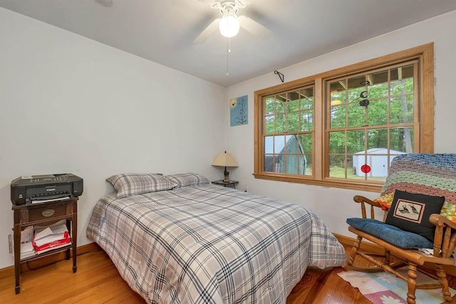 481 New Orchard Rd, Epsom, NH 03234 - bedroom with light wood-style flooring and ceiling fan