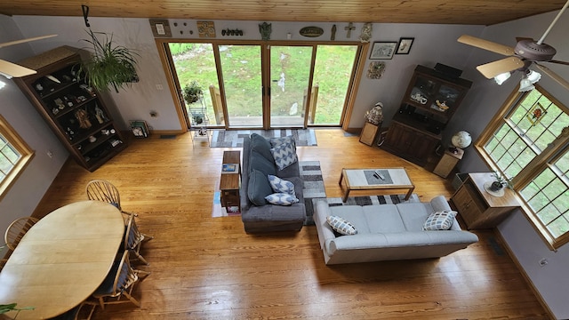 481 New Orchard Rd, Epsom, NH 03234 - living area featuring light wood-style floors, plenty of natural light, ceiling fan, and wooden ceiling
