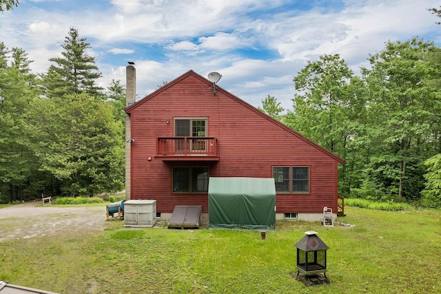 481 New Orchard Rd, Epsom, NH 03234 - rear view of property featuring a chimney, a balcony, and a yard