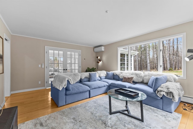 214 Upper Hollow Rd, Stowe, VT 05672 - living area with a wall mounted air conditioner, french doors, wood finished floors, ornamental molding, and baseboard heating