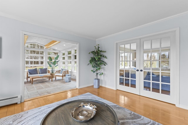 214 Upper Hollow Rd, Stowe, VT 05672 - living area featuring french doors, a baseboard radiator, wood-type flooring, and crown molding