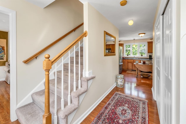 148 Deer Meadow Rd, Pittsfield, NH 03263 - stairway with wood finished floors and baseboards