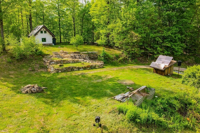 417 Maple Hill Rd, Arlington, VT 05250 - view of grassy yard with an outbuilding and a forest view