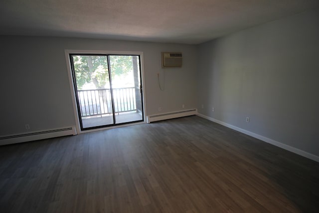 11 Tiffany Rd Unit 5, Salem, NH 03079 - empty room with a baseboard radiator, a wall mounted AC, and dark wood-style flooring