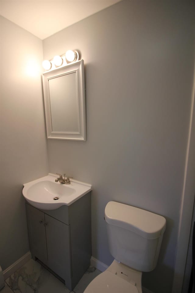 11 Tiffany Rd Unit 5, Salem, NH 03079 - half bathroom featuring vanity and marble look tile flooring