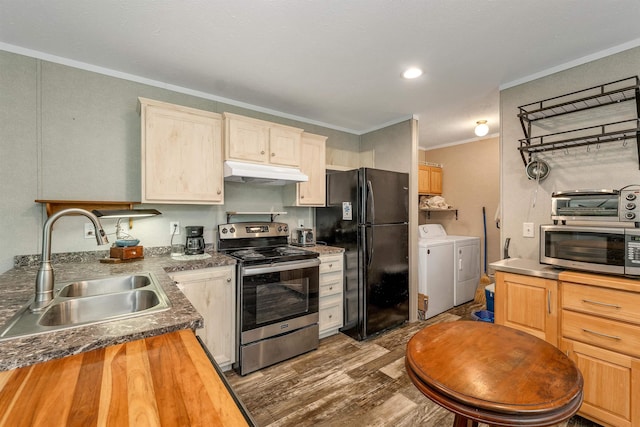 205 Windsor Rd, Hillsborough, NH 03244 - kitchen featuring stainless steel appliances, washing machine and clothes dryer, under cabinet range hood, ornamental molding, and wood finished floors