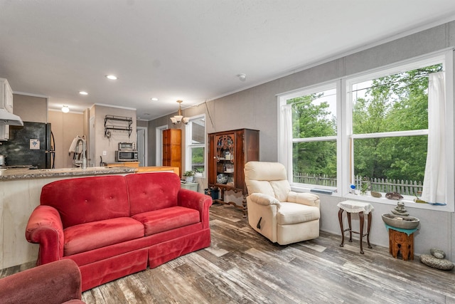 205 Windsor Rd, Hillsborough, NH 03244 - living area featuring wood finished floors, recessed lighting, a chandelier, and crown molding