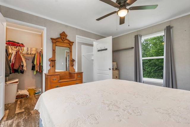 205 Windsor Rd, Hillsborough, NH 03244 - bedroom featuring wood finished floors, crown molding, a spacious closet, a closet, and a ceiling fan
