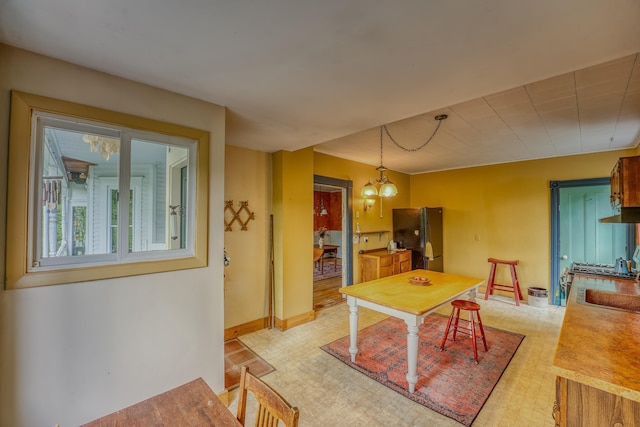 34 Union St, Littleton, NH 03561 - dining area featuring baseboards and a chandelier