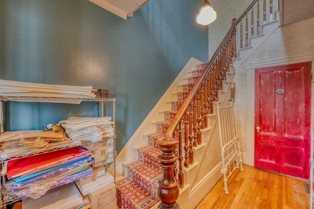 34 Union St, Littleton, NH 03561 - stairway featuring wood finished floors and ornamental molding
