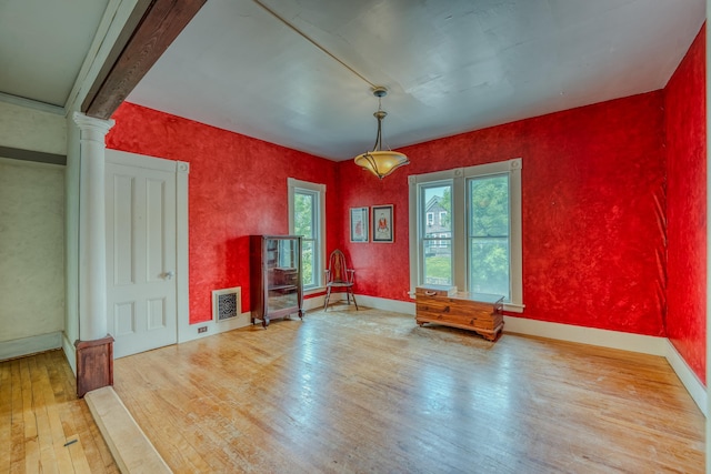 34 Union St, Littleton, NH 03561 - unfurnished room with hardwood / wood-style floors and decorative columns
