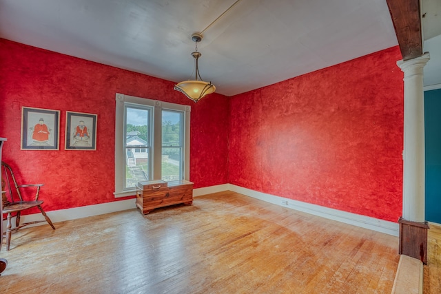 34 Union St, Littleton, NH 03561 - empty room featuring hardwood / wood-style flooring and ornate columns