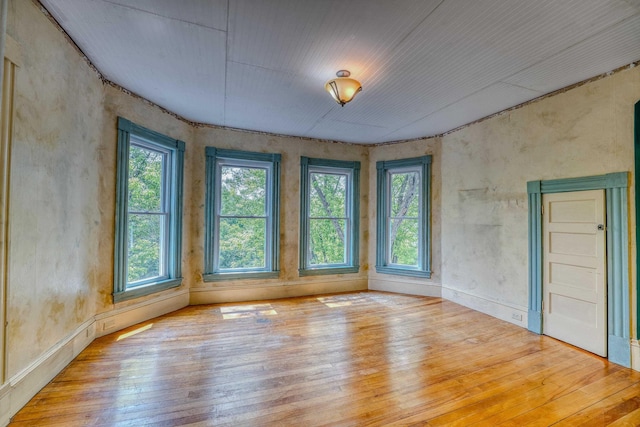 34 Union St, Littleton, NH 03561 - spare room featuring healthy amount of natural light and hardwood / wood-style flooring