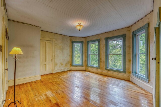 34 Union St, Littleton, NH 03561 - spare room with light wood finished floors, plenty of natural light, and wooden ceiling