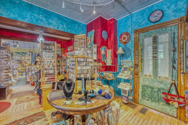 34 Union St, Littleton, NH 03561 - dining area featuring wallpapered walls, hardwood / wood-style flooring, and an ornate ceiling