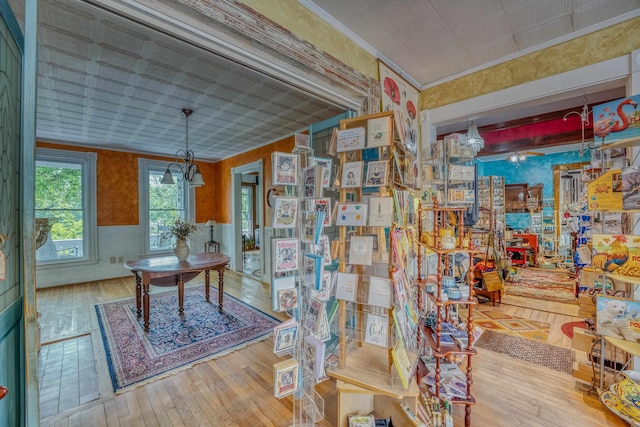 34 Union St, Littleton, NH 03561 - office area with hardwood / wood-style flooring, wallpapered walls, and ornamental molding