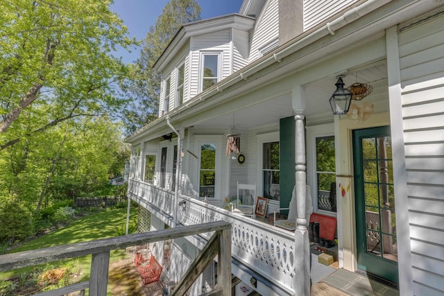 34 Union St, Littleton, NH 03561 - entrance to property with covered porch and a lawn