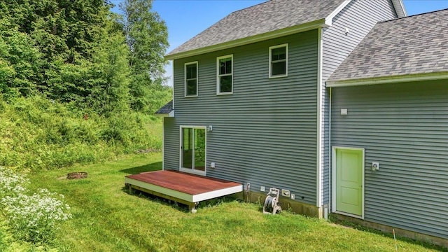54 Gallagher Acres Ext, Moretown, VT 05676 - back of property with a shingled roof, a wooden deck, and a lawn