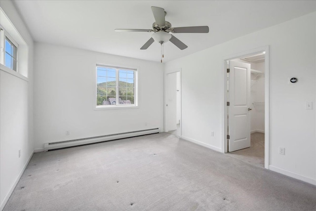 54 Gallagher Acres Ext, Moretown, VT 05676 - unfurnished bedroom with a baseboard radiator, carpet, a spacious closet, ceiling fan, and a closet