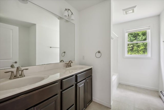54 Gallagher Acres Ext, Moretown, VT 05676 - bathroom featuring double vanity, a baseboard radiator, tile patterned floors, and shower / bath combination