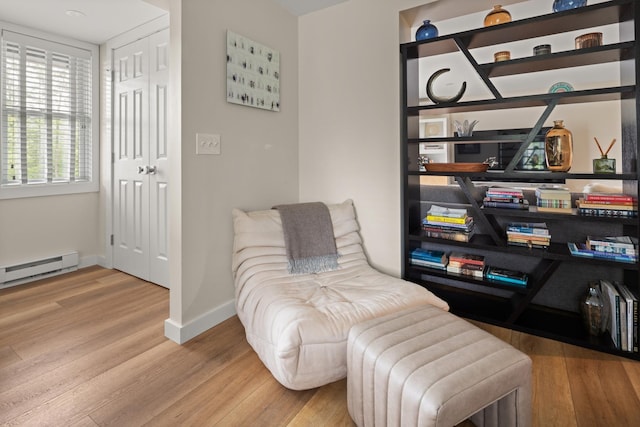 2366 Mountain Rd Unit 1, Stowe, VT 05672 - sitting room featuring baseboard heating and wood finished floors