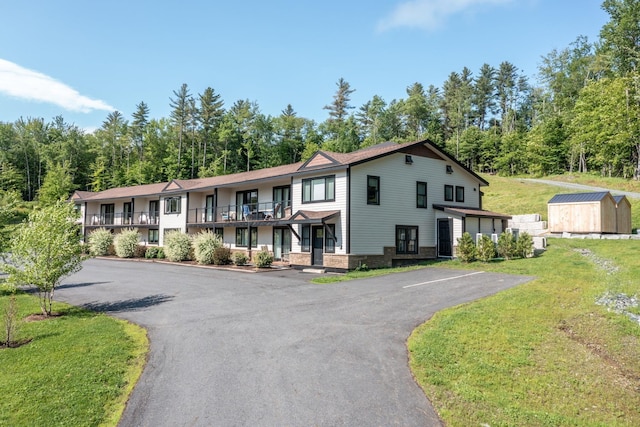 2366 Mountain Rd Unit 1, Stowe, VT 05672 - townhome / multi-family property with a storage shed and a front lawn