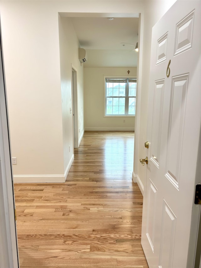 10 Diamond Oaks Blvd Unit 6, Kingston, NH 03848 - corridor featuring a wall mounted AC and light wood-style flooring