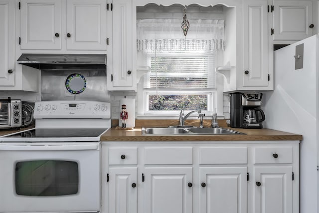 48 Haigh Ave, Salem, NH 03079 - kitchen with white range with electric stovetop, under cabinet range hood, white cabinets, and tasteful backsplash